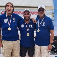 I tre partecipanti alla gara di pesca di Traina costiera e Campioni d'Italia